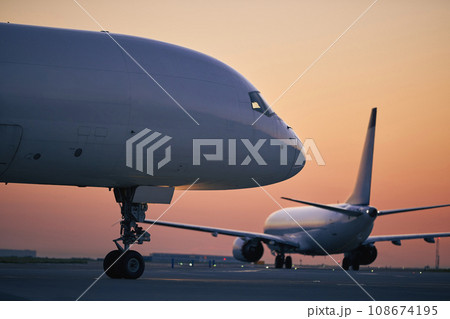 Cargo airplane during morning busy traffic at airport. 108674195
