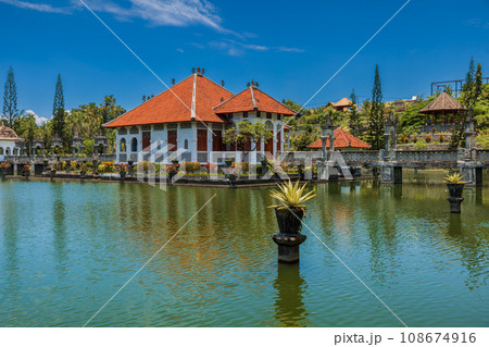 Water Palace Taman Ujung in East Bali. Balinese architecture with lake on sunny day 108674916