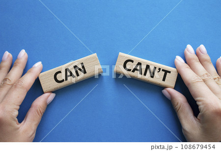 Can or Cant symbol. Concept word Can or Cant on wooden blocks. Businessman hand. Beautiful blue background. Business and Can or Cant concept. Copy space 108679454