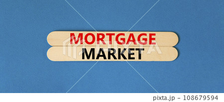 Mortgage market symbol. Concept words Mortgage market on beautiful wooden stick. Beautiful blue table blue background. Business mortgage market concept. Copy space. Mortgage market symbol. Concept words Mortgage market on beautiful wooden stick. Beautiful blue table blue background. Business mortgage market concept. Copy space. 108679594
