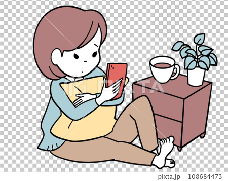A girl holding a cushion and looking at her smartphone leisurely 108684473