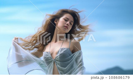青空の見える海で踊りを舞う美しい女性 108686179