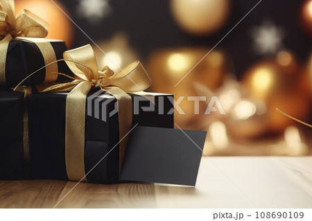 Gift box and golden ribbon on black background with glitter. Black friday sale concept. Banner Gift box and golden ribbon on black background with glitter. Black friday sale concept. Banner 108690109