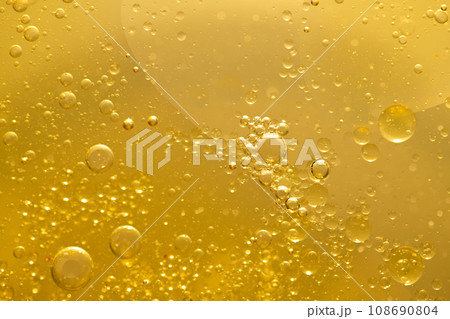 Oil bubble texture on gold background. Oil bubble texture on gold background. 108690804