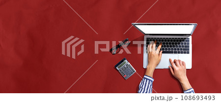 Person using a laptop computer Person using a laptop computer 108693493