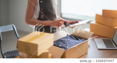 Startup SME small business entrepreneur of freelance Asian woman using laptop and box to receive and review order online to prepare to pack sell to customers, online sme business ideas Startup SME small business entrepreneur of freelance Asian woman using laptop and box to receive and review order online to prepare to pack sell to customers, online sme business ideas 108695047