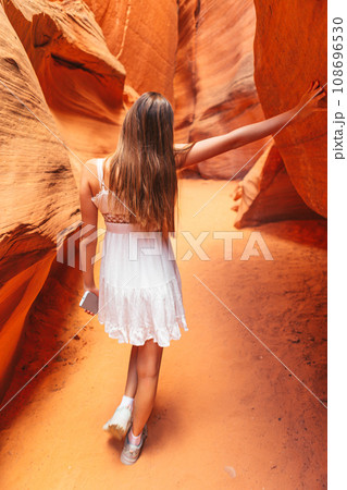 Young girl exploring Antilope Canyon in Arizona. Antilope canyon the most beautiful canyon in USA 108696530