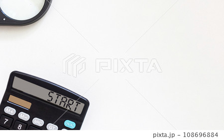Calculator with text Start on display. Business and financial concept. Place to write Calculator with text Start on display. Business and financial concept. Place to write 108696884