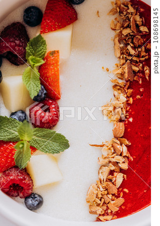 Sweet milk semolina porridge with strawberries on beautiful plate. Delicious breakfast for children Sweet milk semolina porridge with strawberries on beautiful plate. Delicious breakfast for children 108698145