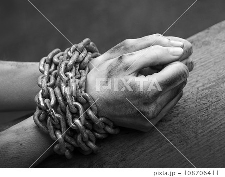 Women's hands in iron chains 108706411