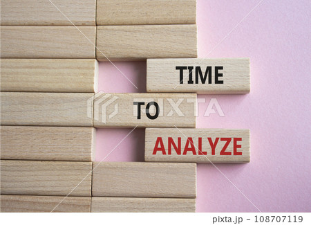 Time to Analyze symbol. Concept word Time to Analyze on wooden blocks. Beautiful pink background. Business and Time to Analyze concept. Copy space Time to Analyze symbol. Concept word Time to Analyze on wooden blocks. Beautiful pink background. Business and Time to Analyze concept. Copy space 108707119