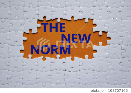 The new norm symbol. Concept words The new norm on white puzzle. Beautiful orange background. Business and The new norm concept. Copy space. 108707166