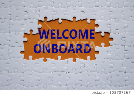 Welcome onboard symbol. Concept words Welcome onboard on white puzzle. Beautiful orange background. Business and Welcome onboard concept. Copy space. 108707167