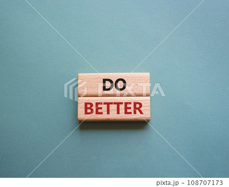 Do better symbol. Wooden blocks with words Do better. Beautiful grey green background. Business and Do better concept. Copy space. Do better symbol. Wooden blocks with words Do better. Beautiful grey green background. Business and Do better concept. Copy space. 108707173