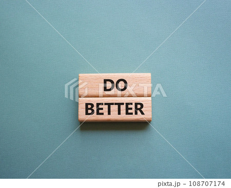Do better symbol. Wooden blocks with words Do better. Beautiful grey green background. Business and Do better concept. Copy space. 108707174