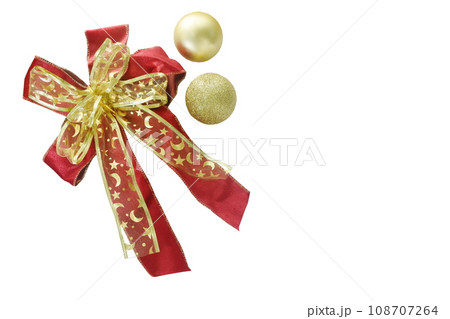 golden ball and red velvet ribbon for decoration in Christmas and new year festival isolated on white background golden ball and red velvet ribbon for decoration in Christmas and new year festival isolated on white background 108707264