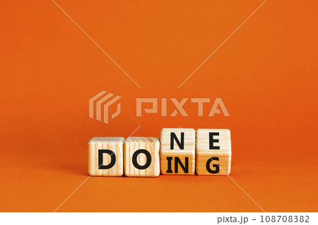 Doing and done symbol. Concept words Doing Done on wooden block. Beautiful orange table orange background. Business doing and done concept. Copy space. Doing and done symbol. Concept words Doing Done on wooden block. Beautiful orange table orange background. Business doing and done concept. Copy space. 108708382