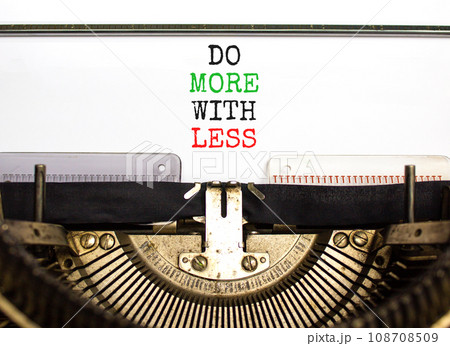 Do more with less symbol. Concept word Do more with less typed on beautiful old retro typewriter. Beautiful white paper background. Business do more with less concept. Copy space. 108708509