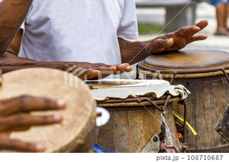 Percussionists playing their instruments Percussionists playing their instruments 108710687