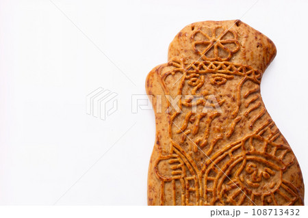 St. Nicolas cookie on white background. 5th December holiday in the Netherlands St. Nicolas cookie on white background. 5th December holiday in the Netherlands 108713432