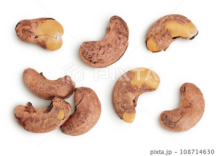 cashew nuts heap with shell isolated on white background. Top view. Flat lay cashew nuts heap with shell isolated on white background. Top view. Flat lay 108714630
