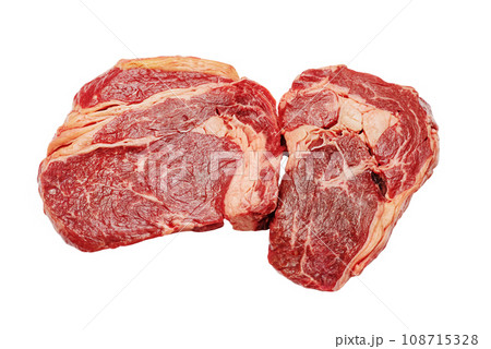Two pieces of beef steak isolated on a white background. Two pieces of beef steak isolated on a white background. 108715328