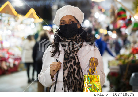 Portrait of a Latin American woman in a mask who came to a Christmas fair Portrait of a Latin American woman in a mask who came to a Christmas fair 108718678