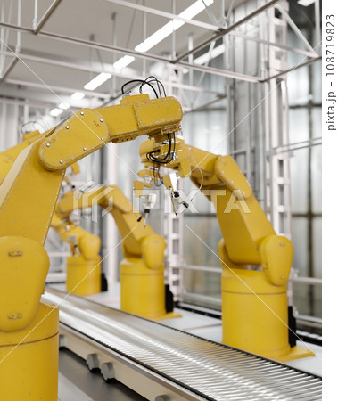 Yellow robot arms in a production line over a conveyor belt in a factory. Automated manufacturing. 108719823