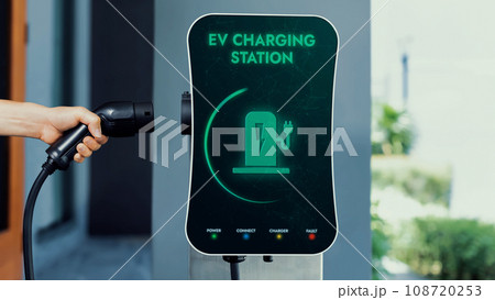 Home electric charging station showing battery status interface on screen.Peruse 108720253