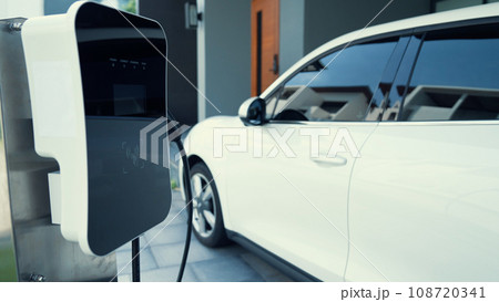 Progressive concept of home charging station providing clean energy for EV cars. 108720341