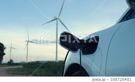 Progressive combination of EV car, charging station and wind turbine. Progressive combination of EV car, charging station and wind turbine. 108720481