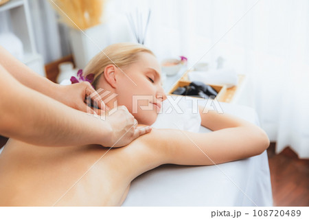 Caucasian woman customer enjoying relaxing anti-stress massage. Quiescent 108720489