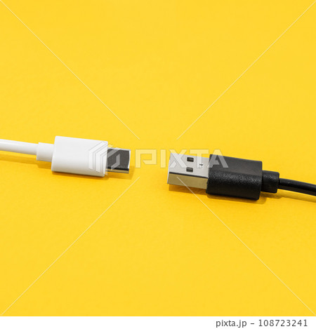 USB cable, type C cable over yellow background 108723241