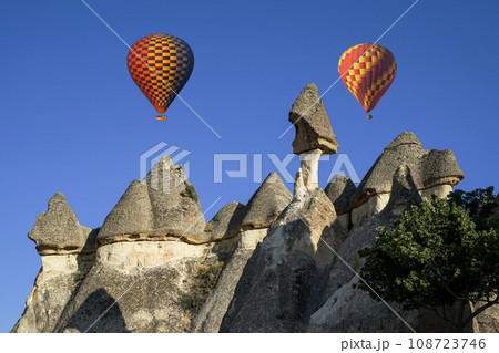 A popular holiday destination, a natural wonder. A holiday destination where you can travel in the sky with hot air balloons. Impressive view of hot air balloons and fairy chimneys. A popular holiday destination, a natural wonder. A holiday destination where you can travel in the sky with hot air balloons. Impressive view of hot air balloons and fairy chimneys. 108723746