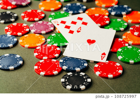 Playing cards and chips on green background 108725997