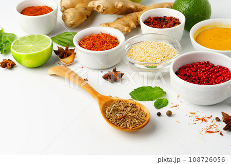 Ginger root and various spices on white background 108726056