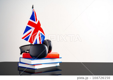 English language learning concept with books and flag of Great Britain English language learning concept with books and flag of Great Britain 108726150