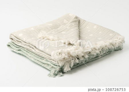 Gray and green muslin blankets on white background Gray and green muslin blankets on white background 108726753