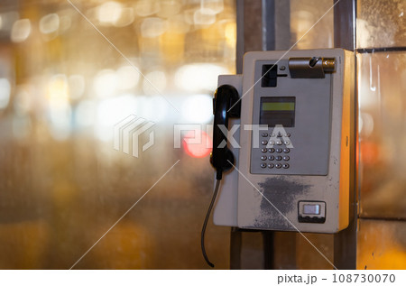 Telephone Hanging on the street of night city 108730070