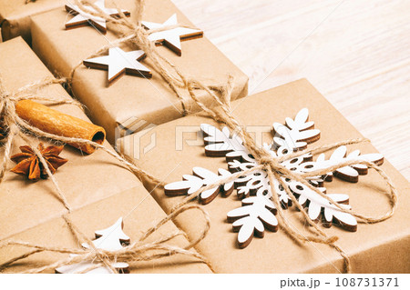 handmade craft christmas gifts or new year rustic presents gifts on wooden background. Toned 108731371