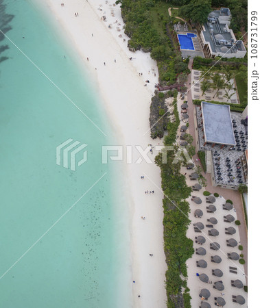 Amazing white sandy beach and turquoise ocean in zanzibar at sunny day Amazing white sandy beach and turquoise ocean in zanzibar at sunny day 108731799