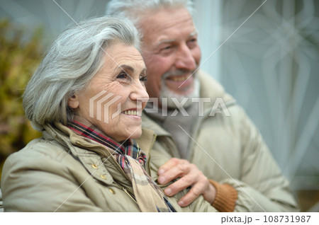 Elderly couple dance in the park in autumn. 108731987