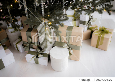 Christmas boxes with gifts under the tree Christmas boxes with gifts under the tree 108733435
