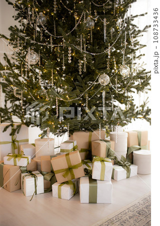 Christmas boxes with gifts under the tree 108733436