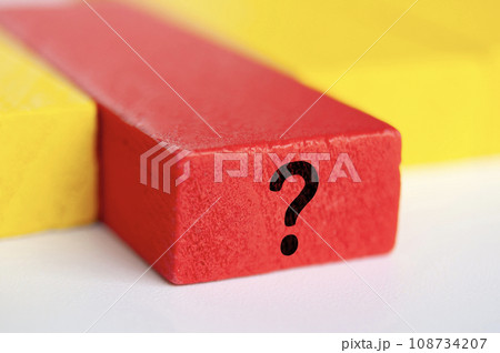 Question mark on red wooden block. Question and answer session. 108734207