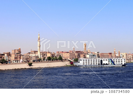 Cruise ship on the Nile river, Egypt, Africa. Luxury Nile Cruise. Summer vacation, relaxing on cruise ships Cruise ship on the Nile river, Egypt, Africa. Luxury Nile Cruise. Summer vacation, relaxing on cruise ships 108734580