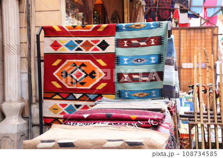 Multicolored carpets on outdoor market on Khan Al-Khalili Bazaar, Cairo, Egypt. Beautiful handmade rugs on the open market bazaar 108734585