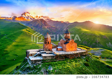 Aerial view of Gergeti trinity church at sunrise in Georgia. 108734783