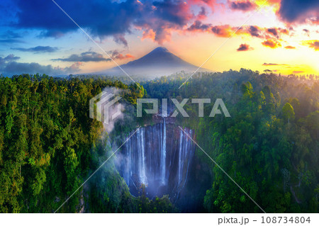 Tumpak Sewu Waterfall and Semeru mountain at sunrise, Indonesia. Tumpak Sewu Waterfall and Semeru mountain at sunrise, Indonesia. 108734804