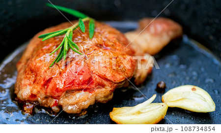 Grilled Wagyu fillet steak and rosemary on hot iron plate. Prime beef fry on electric roaster. Grilled Wagyu fillet steak and rosemary on hot iron plate. Prime beef fry on electric roaster. 108734854